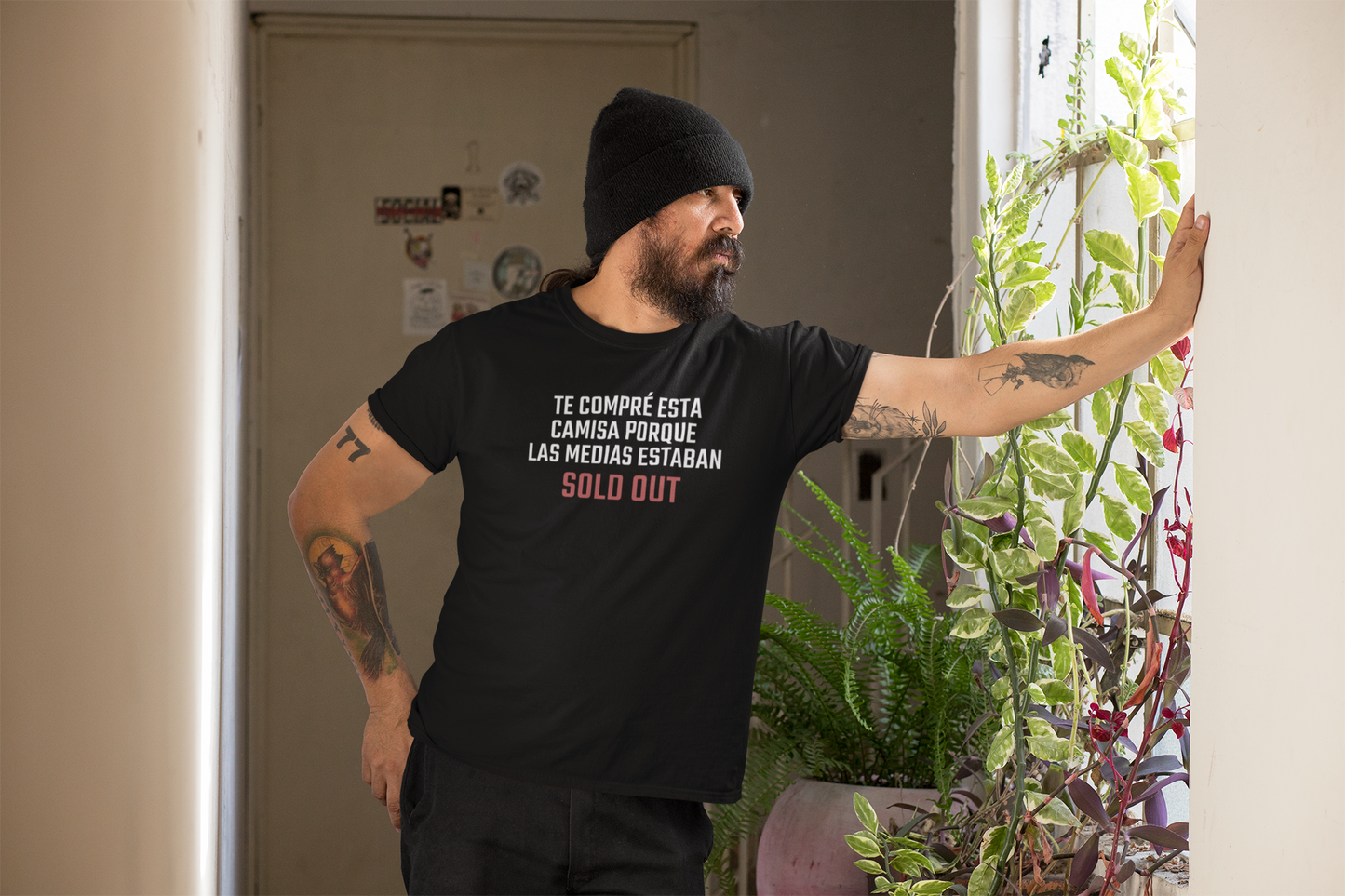 Side profile of bearded boricua dad in beanie wearing funny bilingual Father's Day t-shirt — designed in Puerto Rico by Abimael Medina