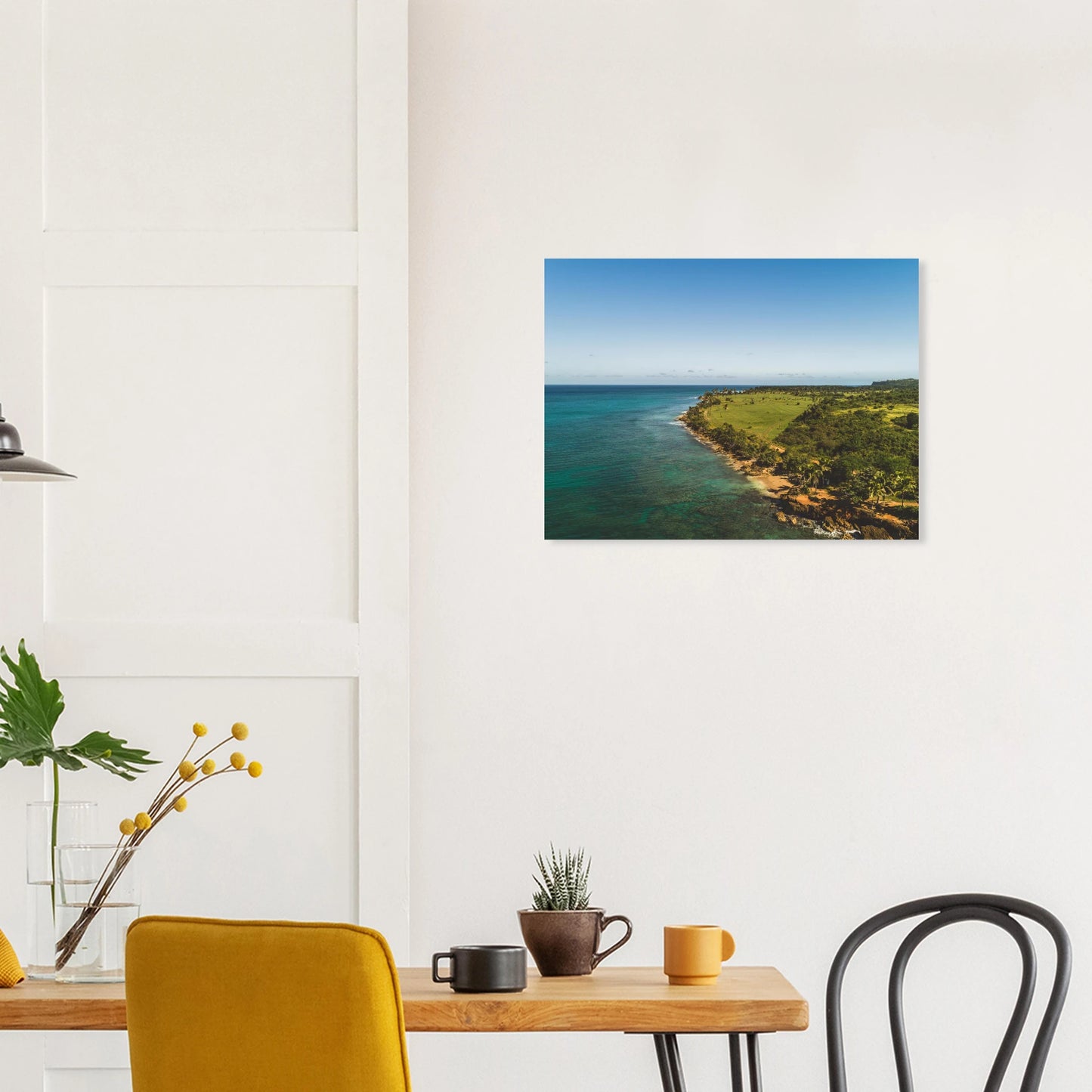 Peña Blanca Aguadilla aerial print — dark interior wall mockup, turquoise Caribbean cliffs PR.