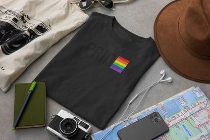 PRIDE Boricua Black Tee Flatlay – Travel Accessories Camera LGBTQ Pride Apparel Puerto Rico