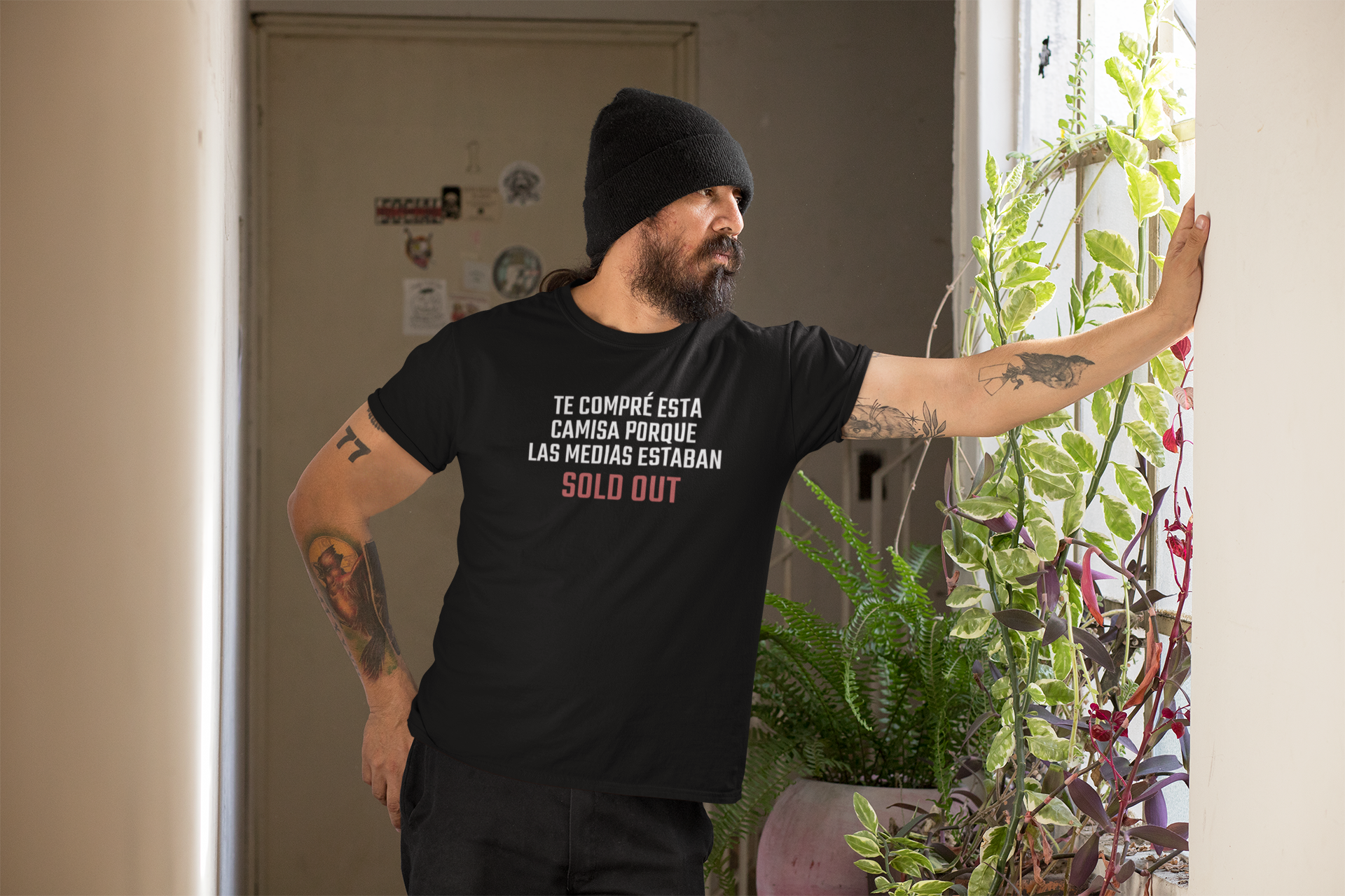 Side profile of bearded boricua dad in beanie wearing funny bilingual Father's Day t-shirt — designed in Puerto Rico by Abimael Medina